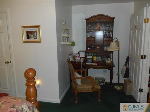 164 Eastern Way Rutherford, NJ 07070 - Photo 3 of 25 a living room with furniture and a mirror