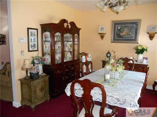 164 Eastern Way Rutherford, NJ 07070 - Photo 5 of 25 a view of a dining room with furniture and wooden floor