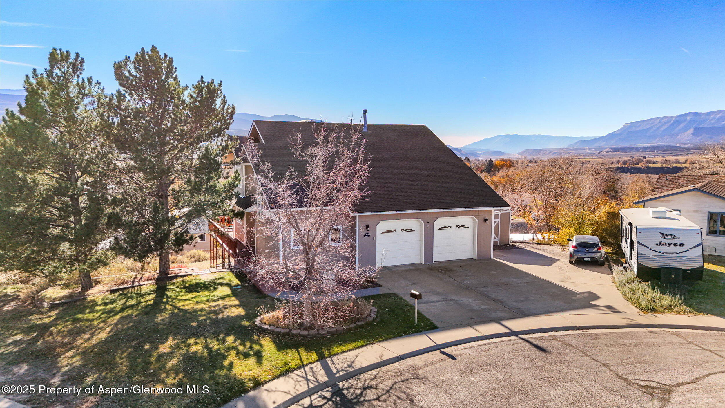 a view of a house with a street