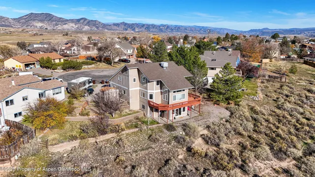 a view of a house with a yard in front of it