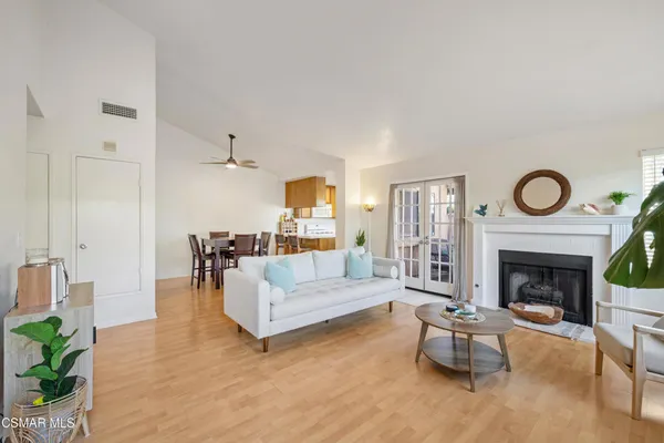 a living room with furniture a fireplace and a fireplace