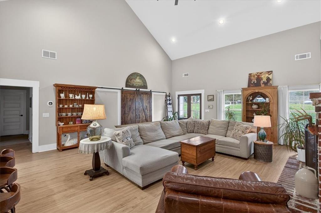14402 Fincher Road Ball Ground, GA 30107 - Photo 12 of 55 a living room with furniture and a large window