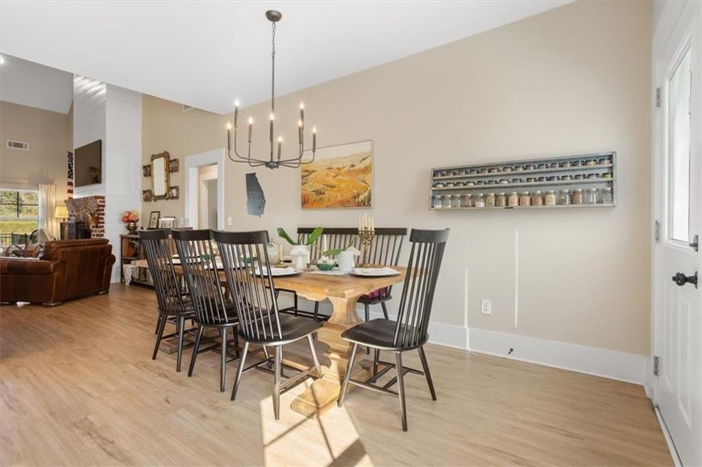 14402 Fincher Road Ball Ground, GA 30107 - Photo 15 of 55 a view of a dining room with furniture and chandelier
