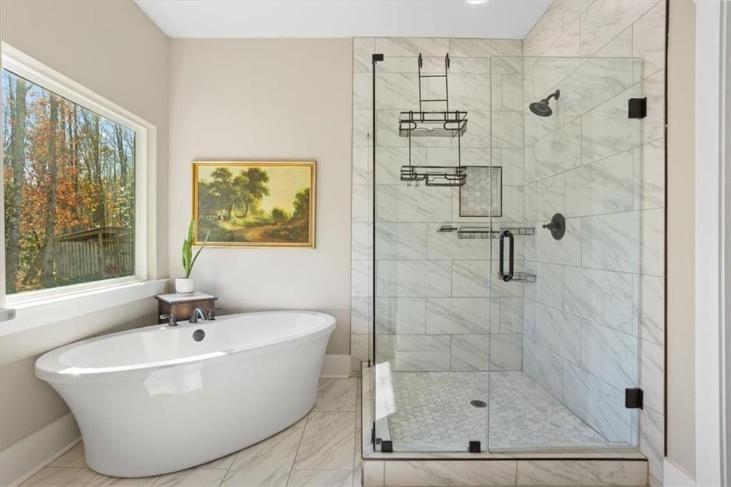 14402 Fincher Road Ball Ground, GA 30107 - Photo 31 of 55 a white bath tub sitting next to a shower