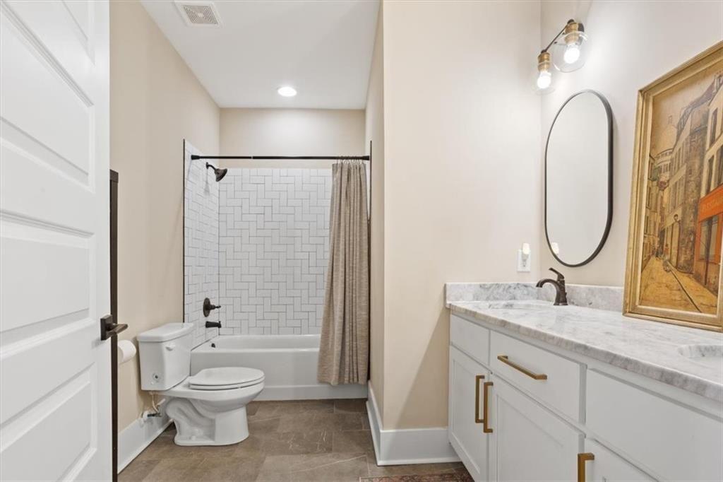 14402 Fincher Road Ball Ground, GA 30107 - Photo 39 of 55 a bathroom with a granite countertop sink toilet and shower