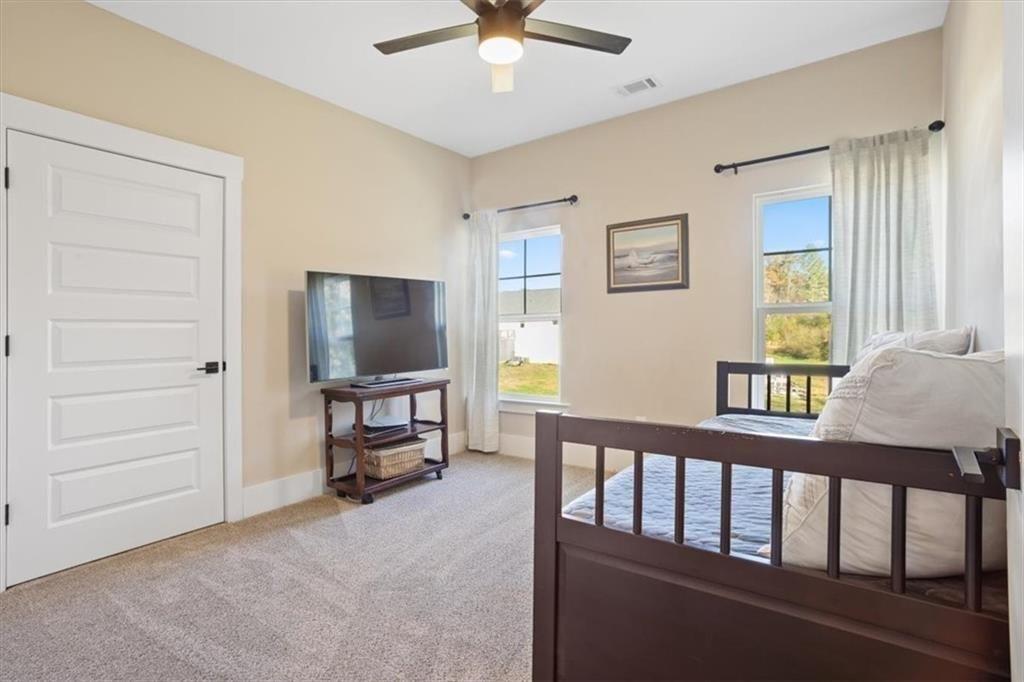 14402 Fincher Road Ball Ground, GA 30107 - Photo 41 of 55 a living room with furniture and a window