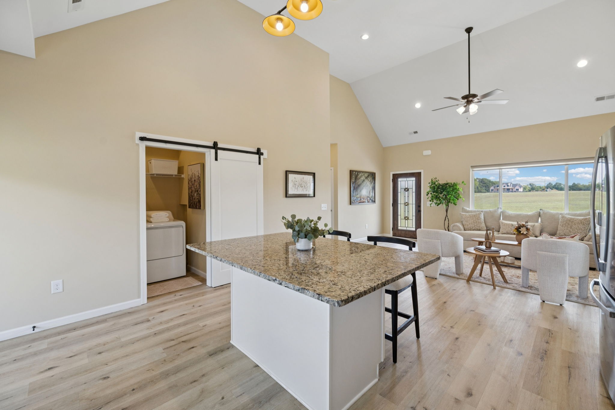 1317 Halls Mill Road Unionville, TN 37180 - Photo 13 of 41 an open kitchen with granite countertop a table and chairs in it