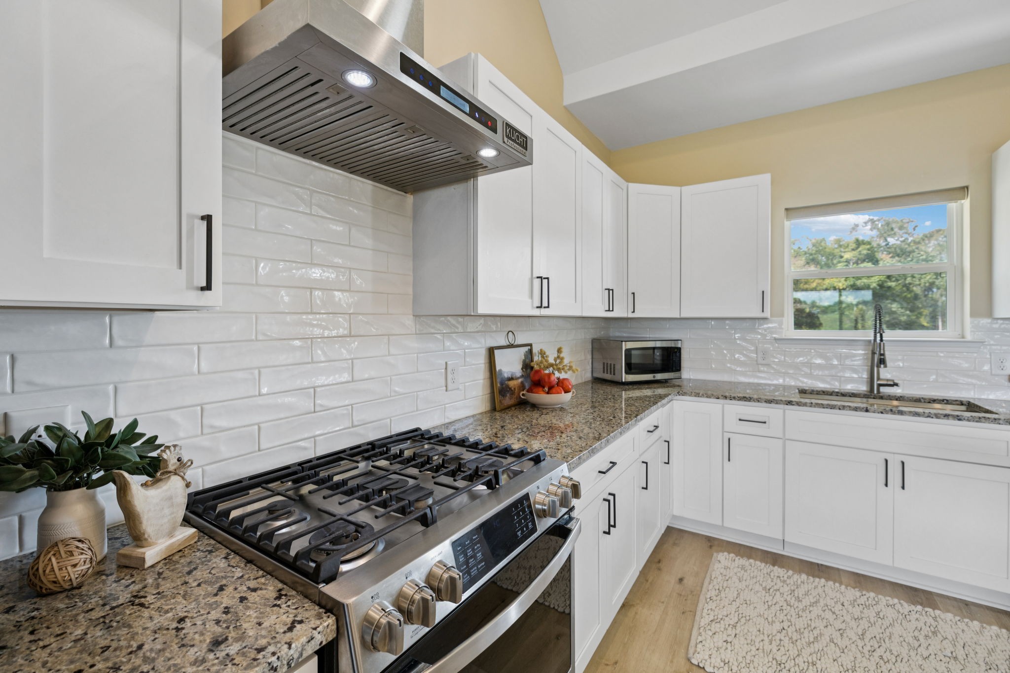 1317 Halls Mill Road Unionville, TN 37180 - Photo 14 of 41 a kitchen with granite countertop a sink stove and cabinets