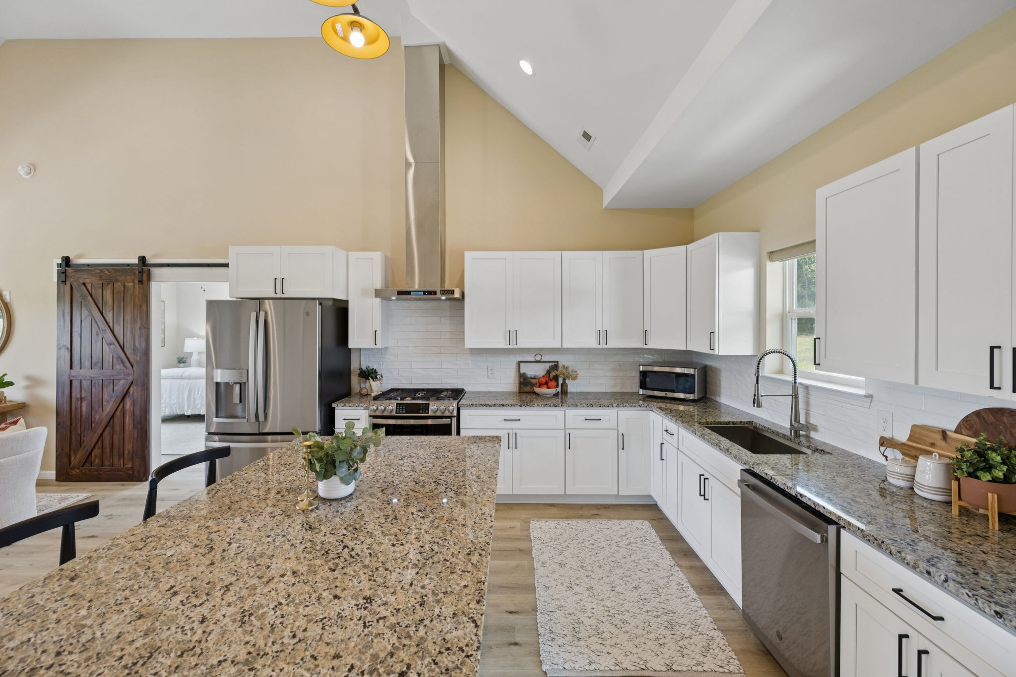 1317 Halls Mill Road Unionville, TN 37180 - Photo 15 of 41 a kitchen with stainless steel appliances granite countertop a sink stove refrigerator and cabinets