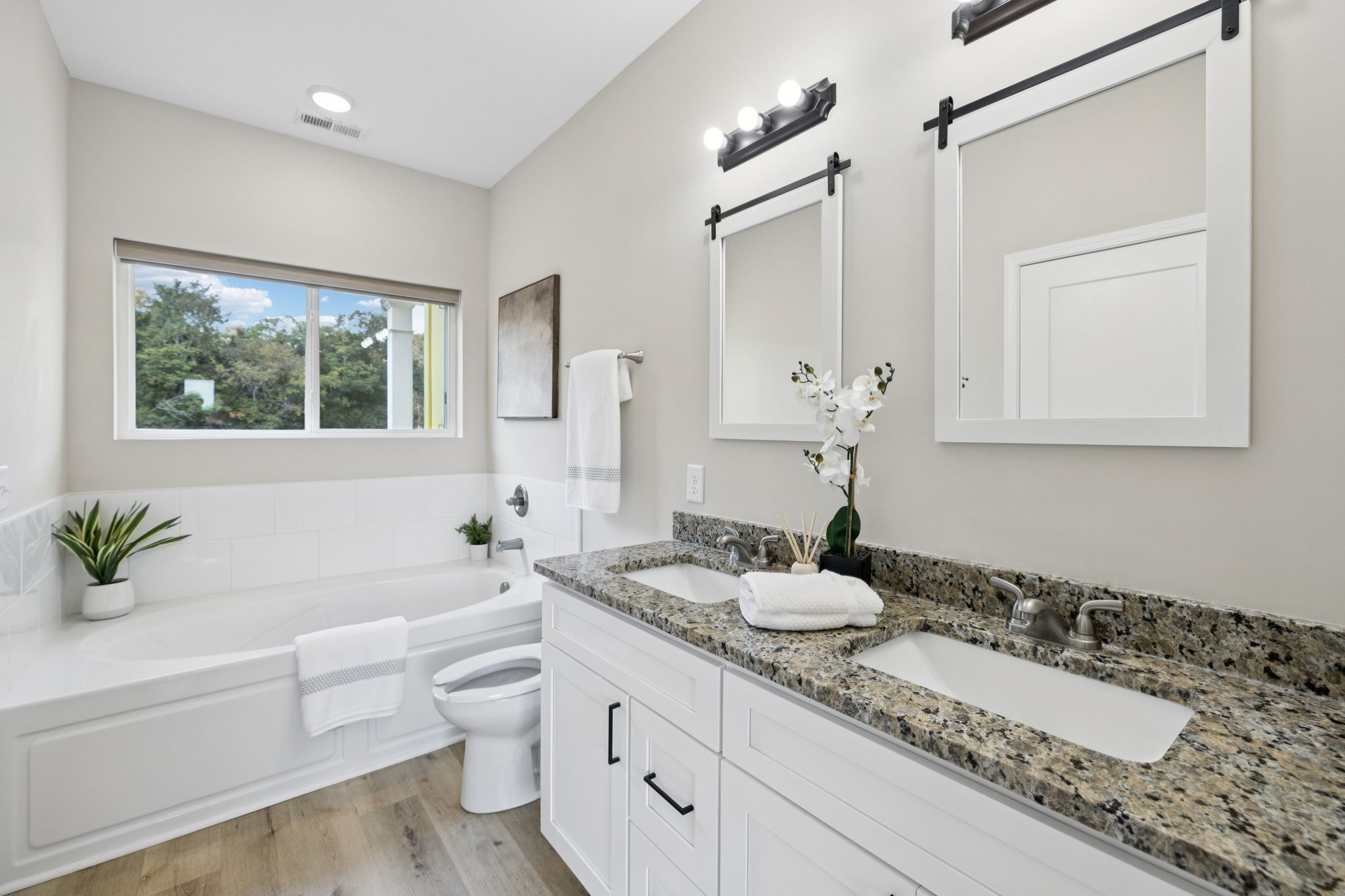 1317 Halls Mill Road Unionville, TN 37180 - Photo 18 of 41 a bathroom with a granite countertop sink and a mirror