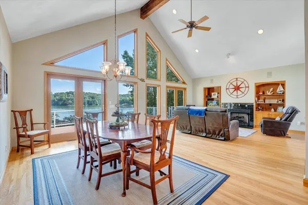 a kitchen with granite countertop a stove a sink and dishwasher wooden cabinets with granite countertops