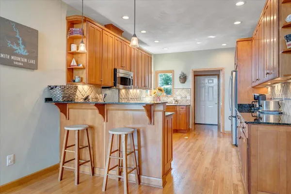 a bedroom with a bed chairs and a window