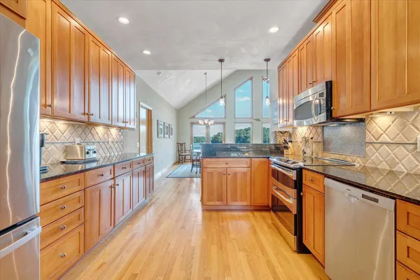 a dining room with a table and chairs