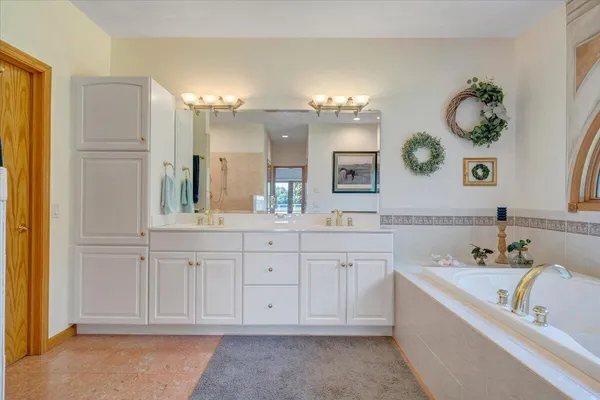 a view of a backyard with plants and large trees