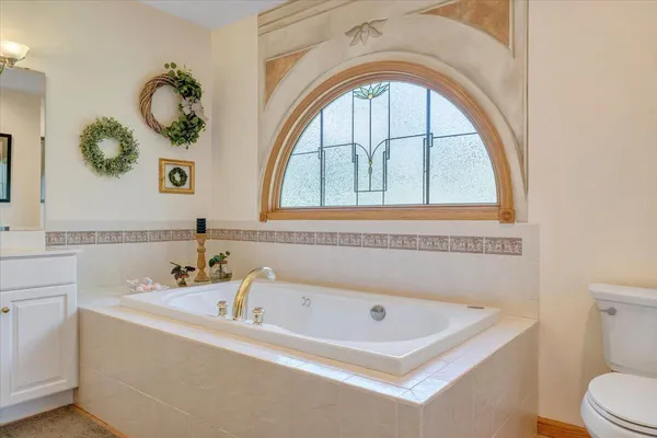 a view of a house with swimming pool next to a yard