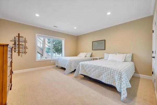 a front view of a house with yard and green space