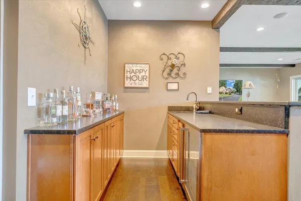 a view of a house with a big yard and large trees