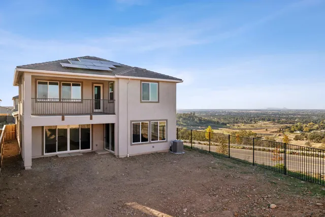 a view of backyard with large trees