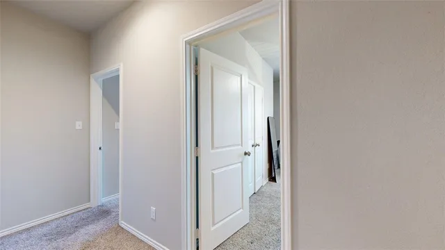 a bedroom with furniture and a flat screen tv