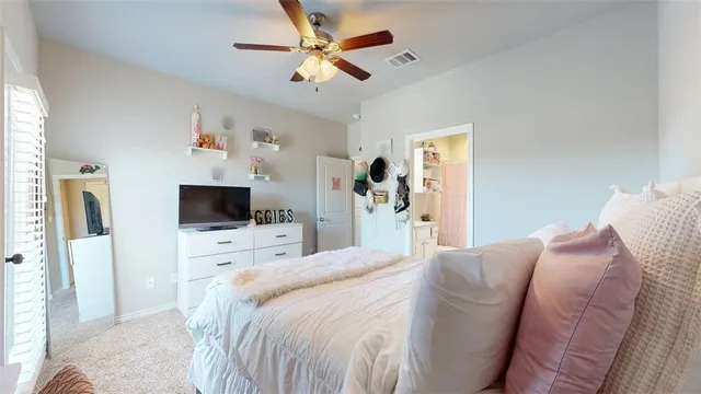 a bathroom with a granite countertop sink a toilet and shower