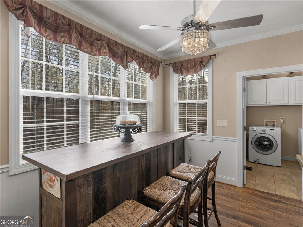 355 Parker Road Covington, GA 30014 - Photo 28 of 60 a view of a dining room with furniture and chandelier