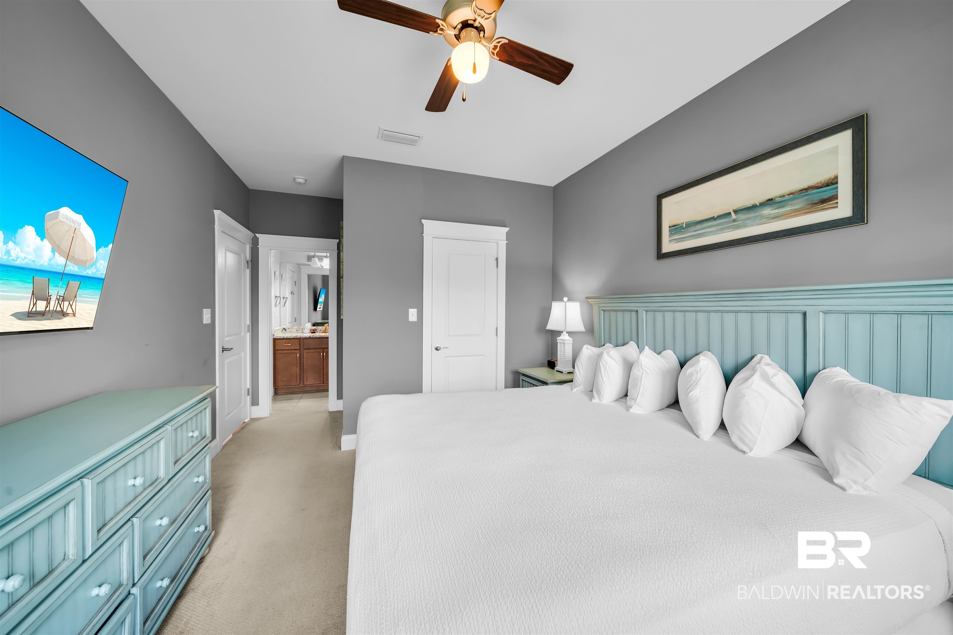 47 Parks Edge Orange Beach, AL 36561 - Photo 29 of 40 Bedroom with light colored carpet, connected bathroom, and a ceiling fan