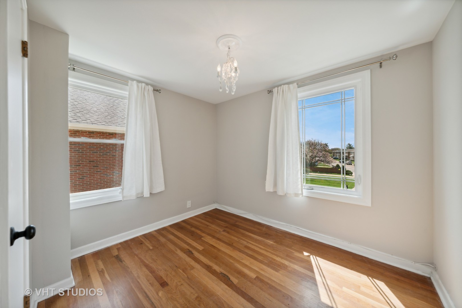 7424 West Gregory Street Chicago, IL 60656 - Photo 12 of 17 a view of an empty room with wooden floor and a window