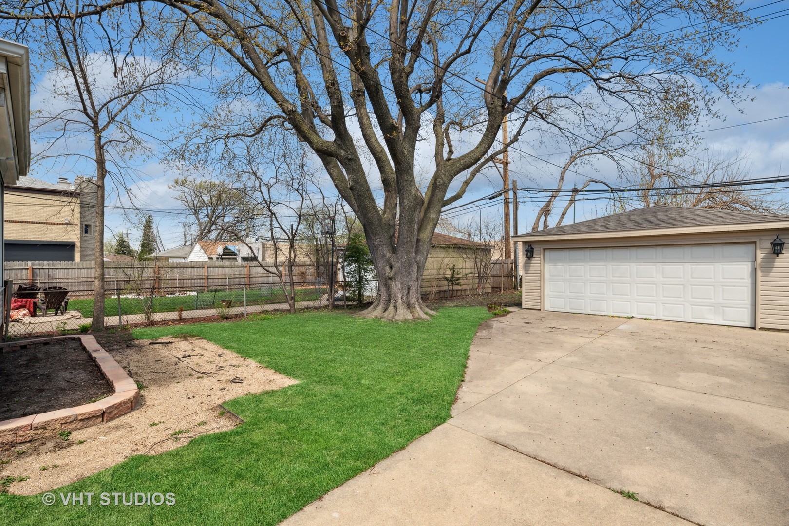 7424 West Gregory Street Chicago, IL 60656 - Photo 16 of 17 a view of a backyard that has a large tree