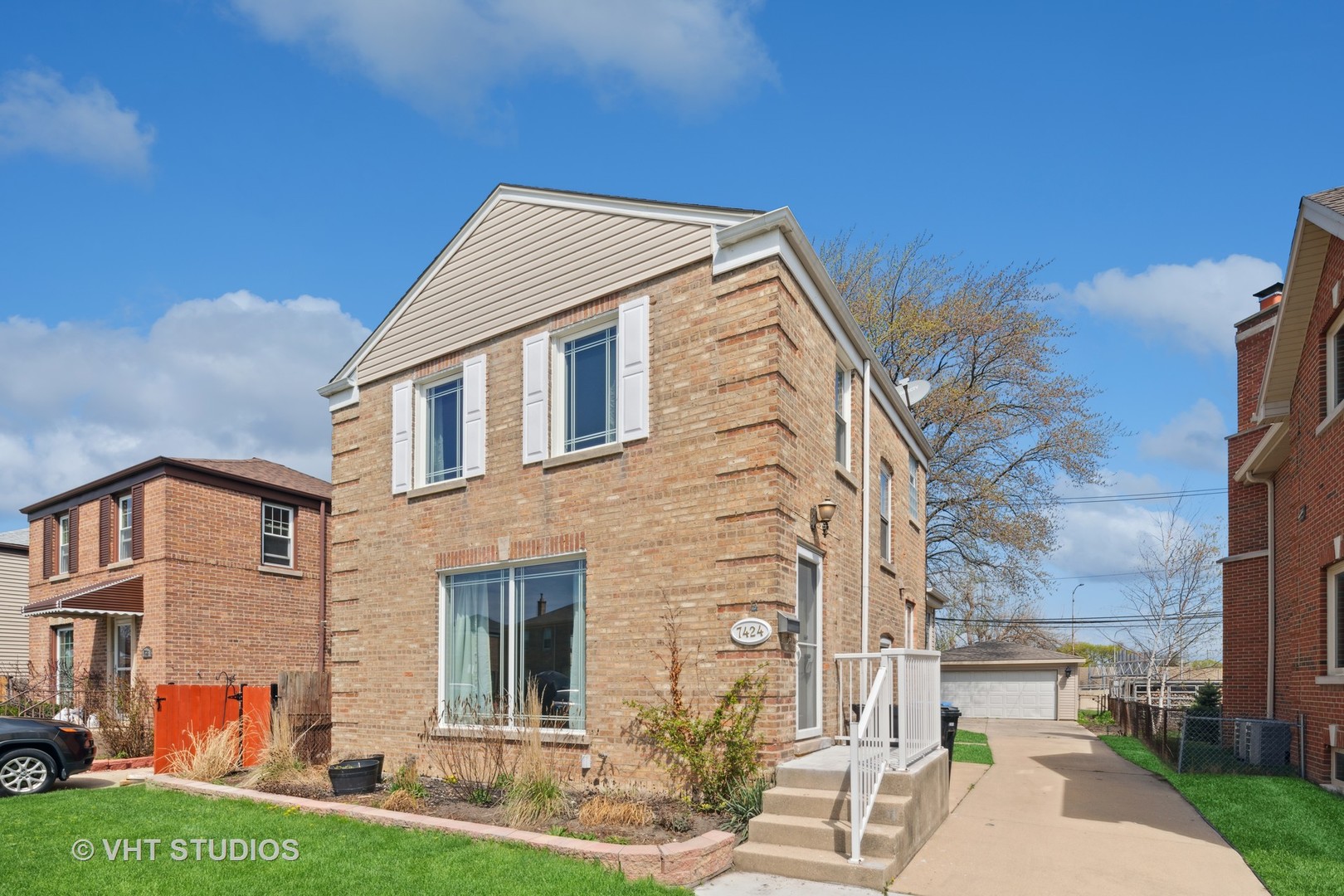 7424 West Gregory Street Chicago, IL 60656 - Photo 2 of 17 a front view of a house with garden