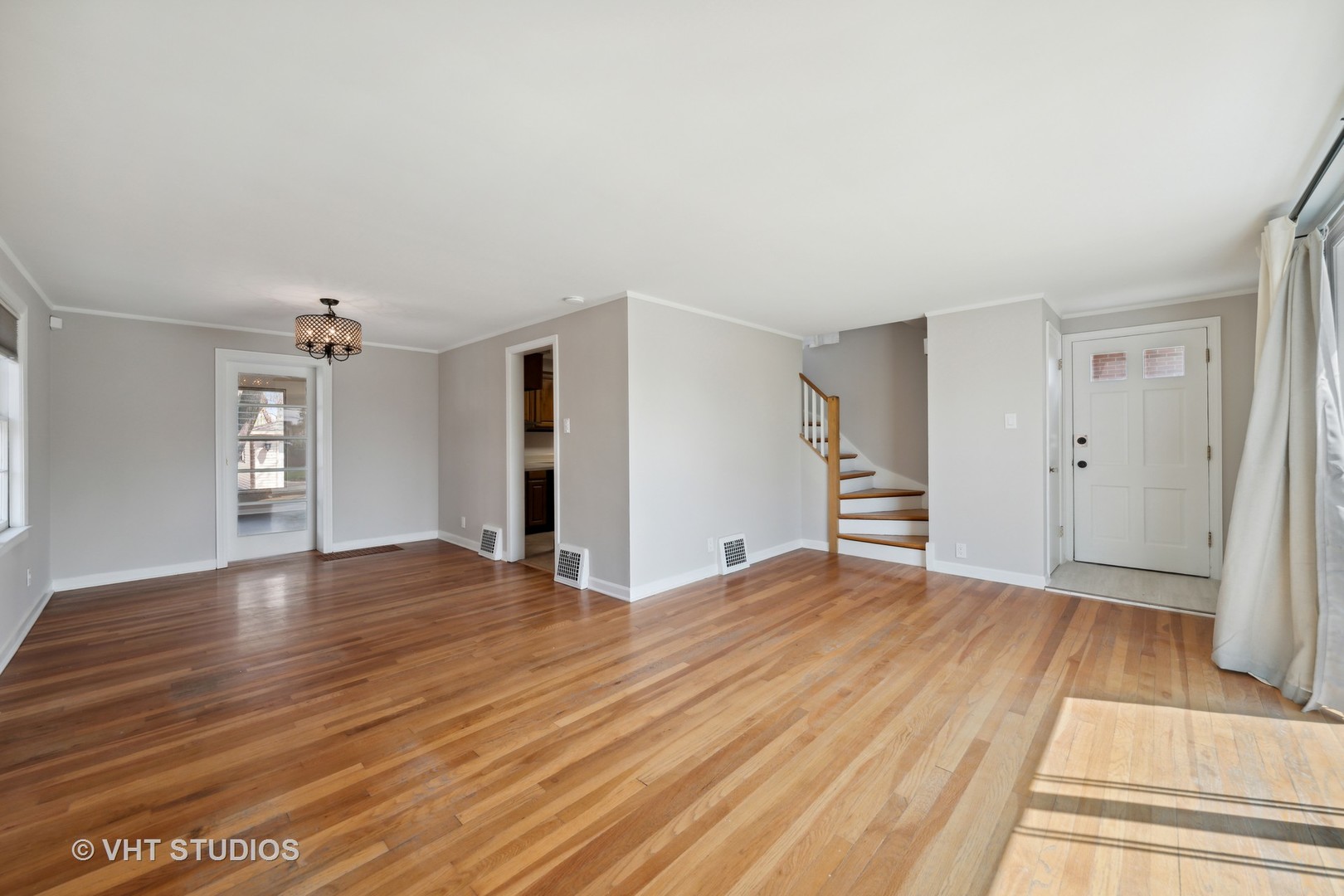 7424 West Gregory Street Chicago, IL 60656 - Photo 4 of 17 wooden floor in an empty room with a window