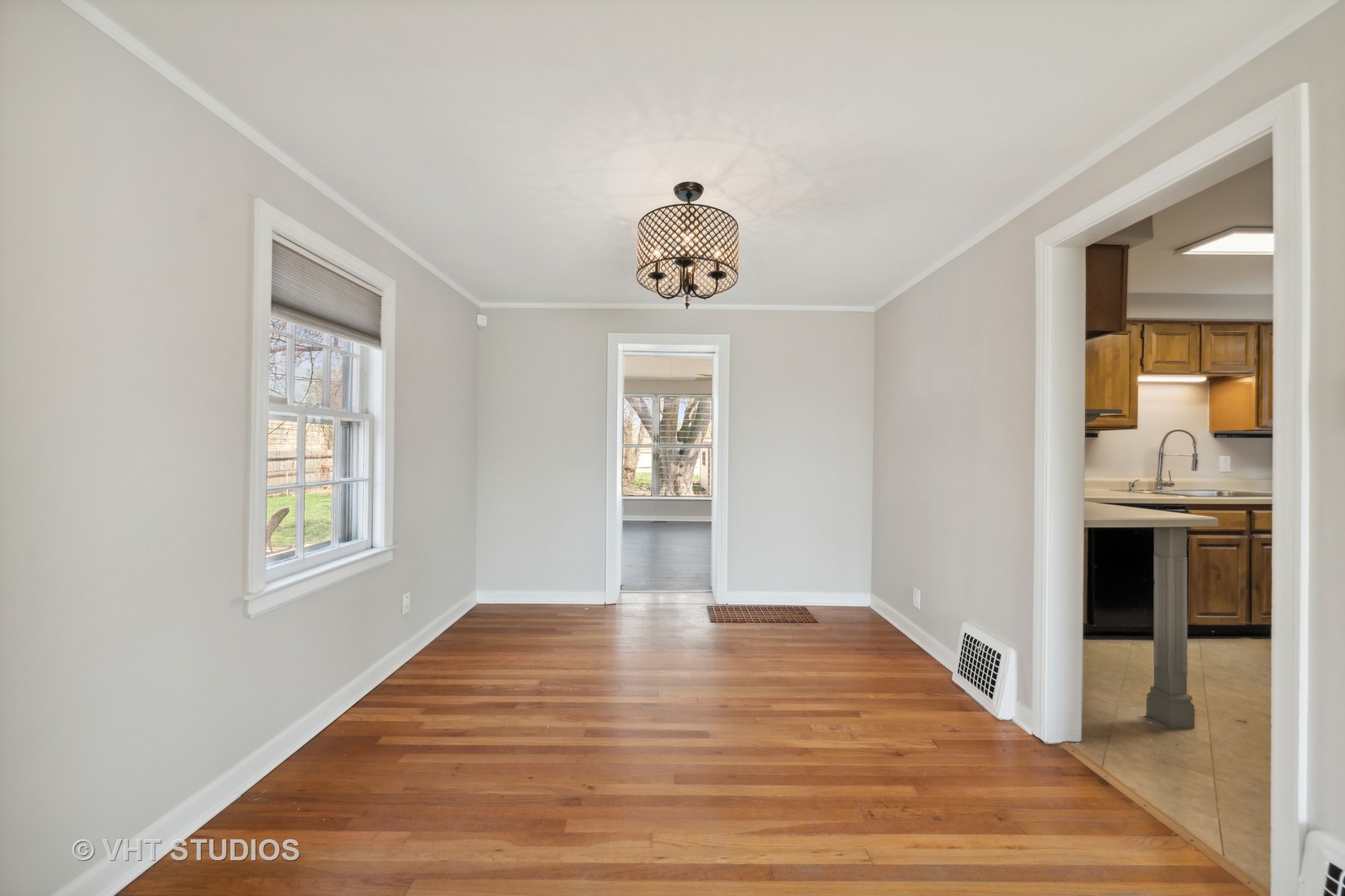 7424 West Gregory Street Chicago, IL 60656 - Photo 5 of 17 a view of an empty room with window and wooden floor