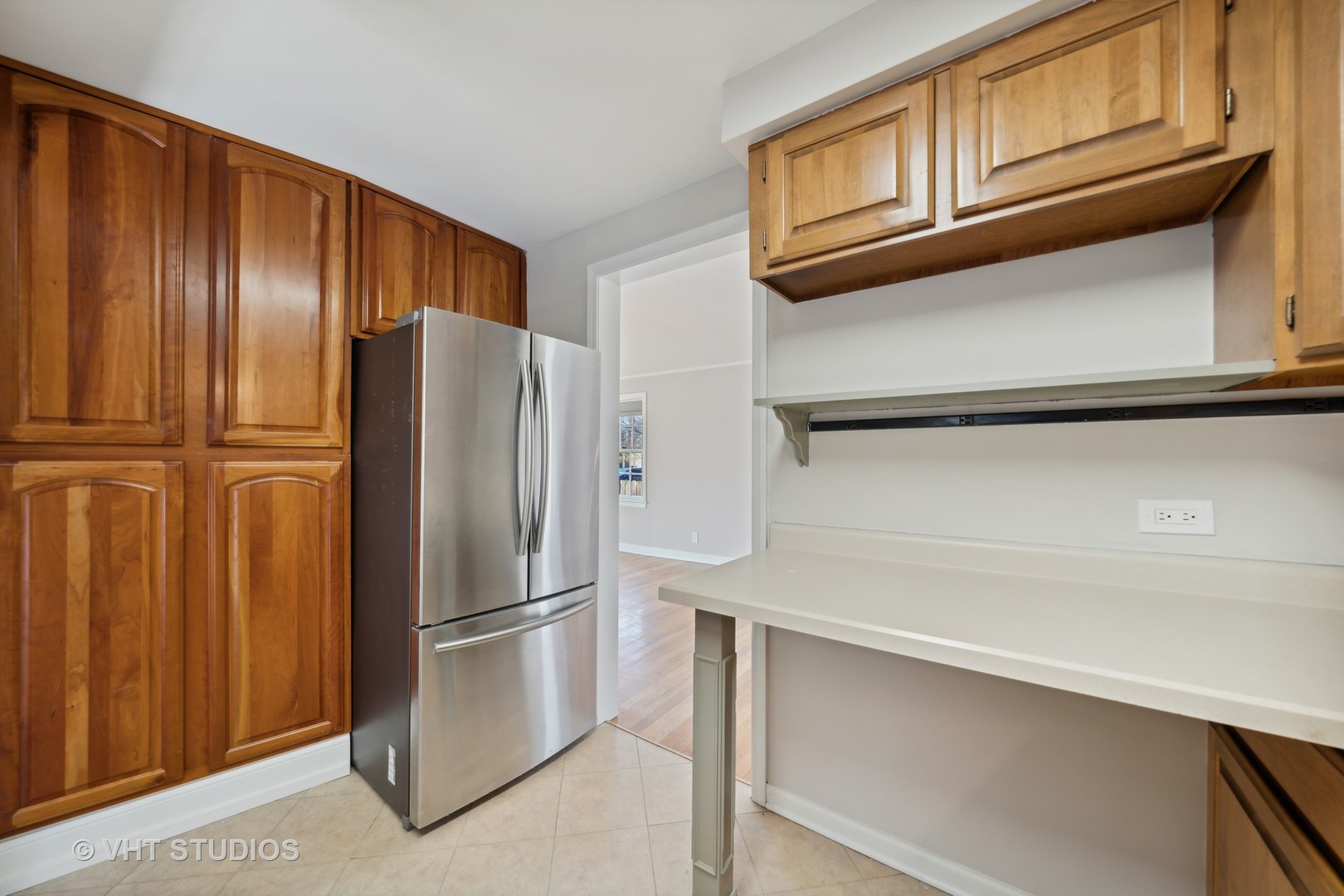 7424 West Gregory Street Chicago, IL 60656 - Photo 7 of 17 a metallic refrigerator freezer sitting in a kitchen
