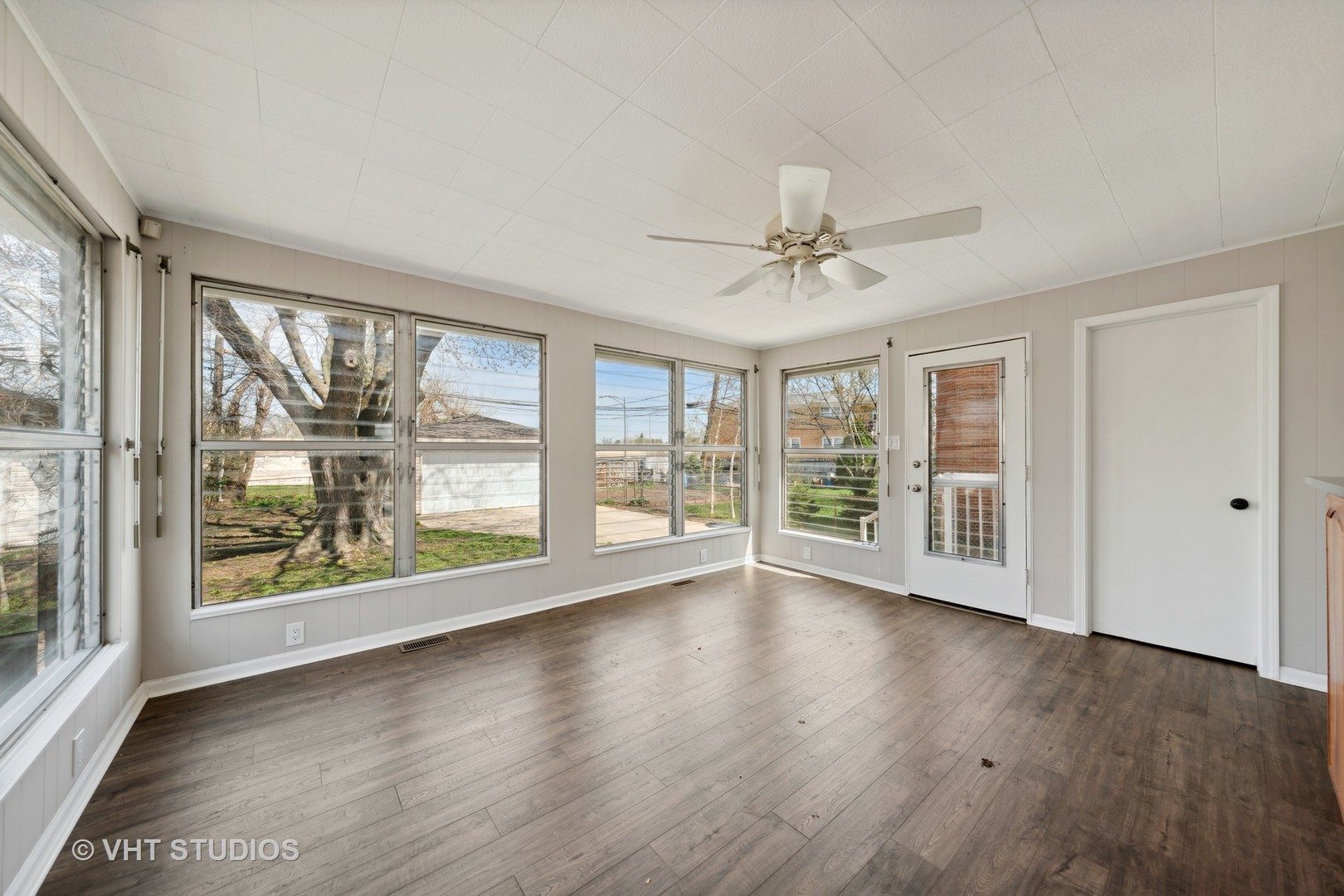7424 West Gregory Street Chicago, IL 60656 - Photo 8 of 17 a view of an empty room with wooden floor and a window