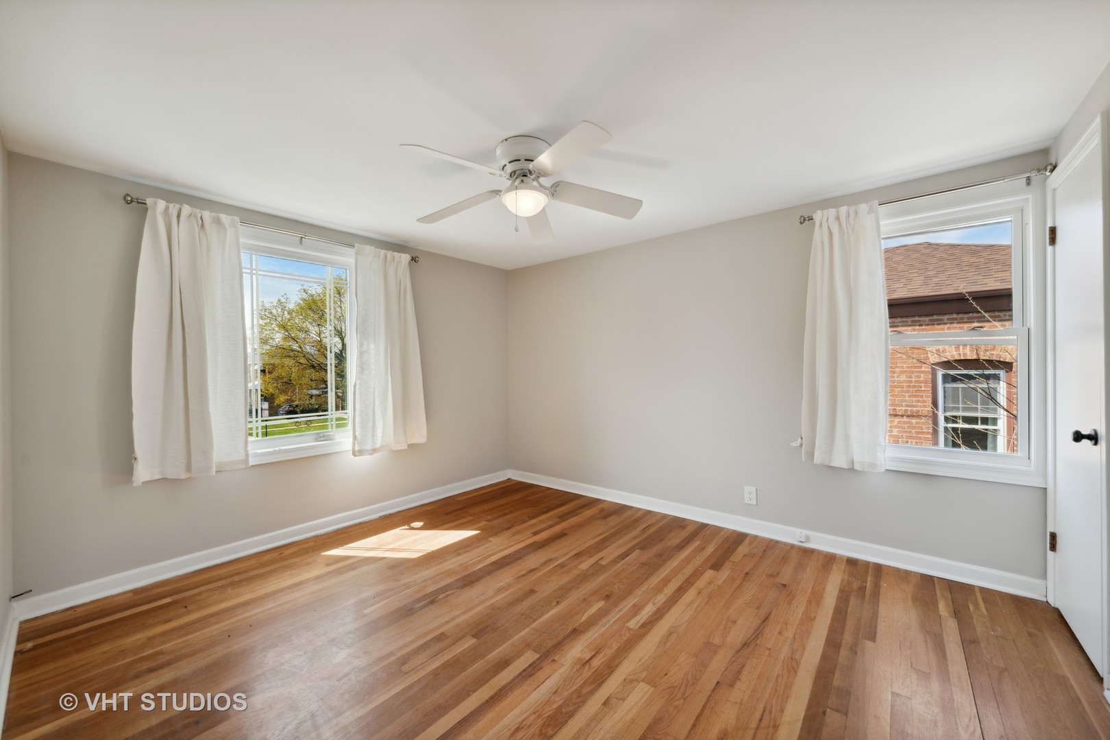 7424 West Gregory Street Chicago, IL 60656 - Photo 10 of 17 a view of empty room with wooden floor and fan