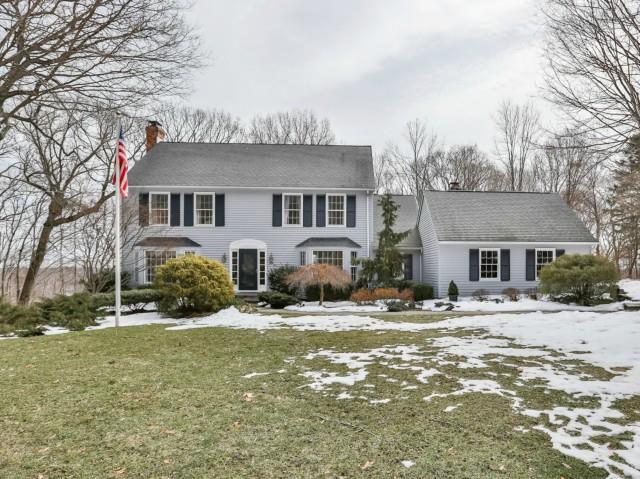 42 Brighton View Road Fairfield, CT 06824 - Photo 1 of 1 a front view of a house with yard and trees