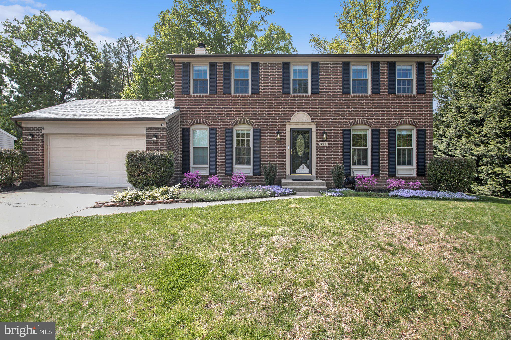 8309 Timber Brook Lane Springfield, VA 22153 - Photo 1 of 39 front view of a house with a yard