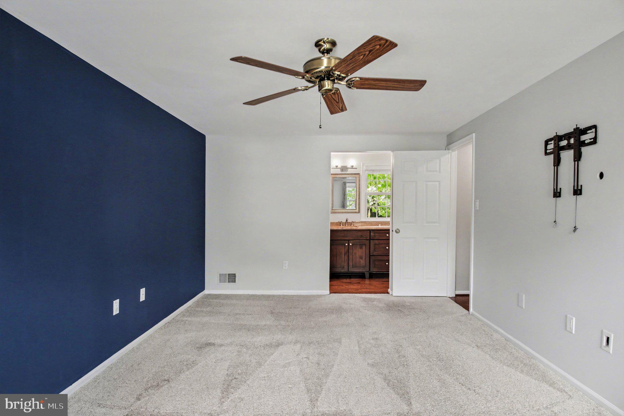 8309 Timber Brook Lane Springfield, VA 22153 - Photo 19 of 39 a view of a livingroom with a ceiling fan and window