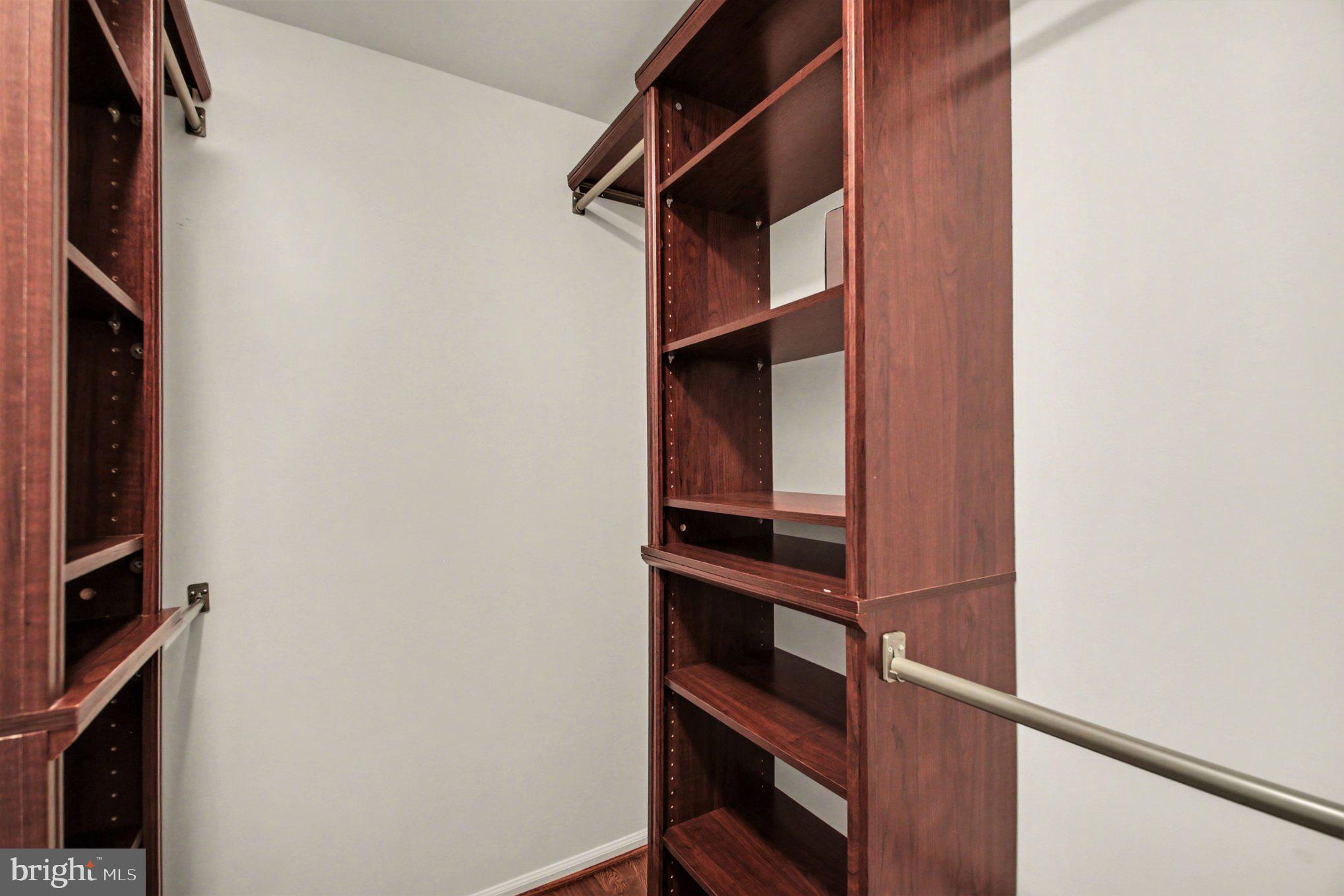 8309 Timber Brook Lane Springfield, VA 22153 - Photo 21 of 39 a view of walk in closet with empty racks