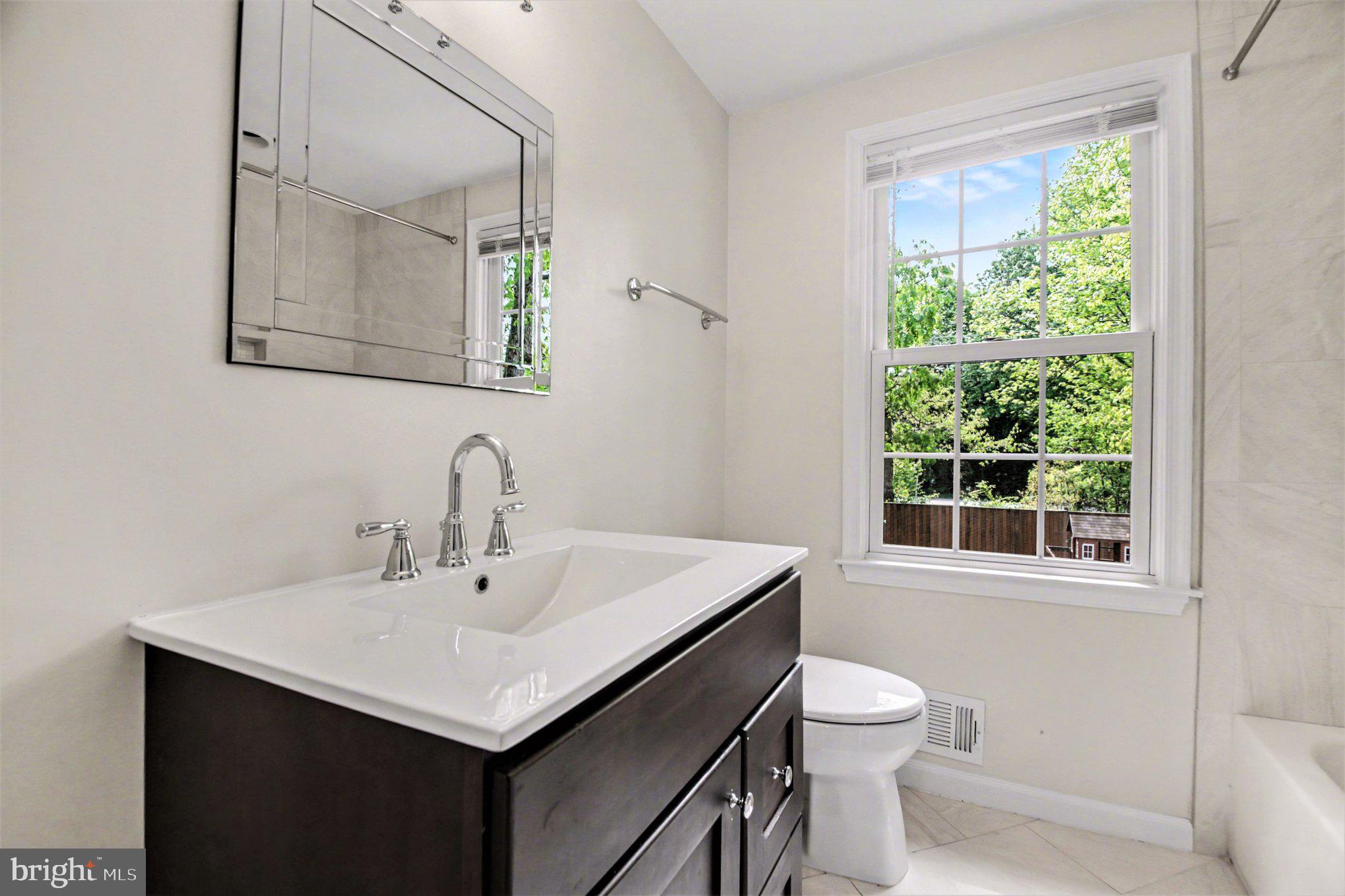 8309 Timber Brook Lane Springfield, VA 22153 - Photo 28 of 39 a bathroom with a sink and a toilet