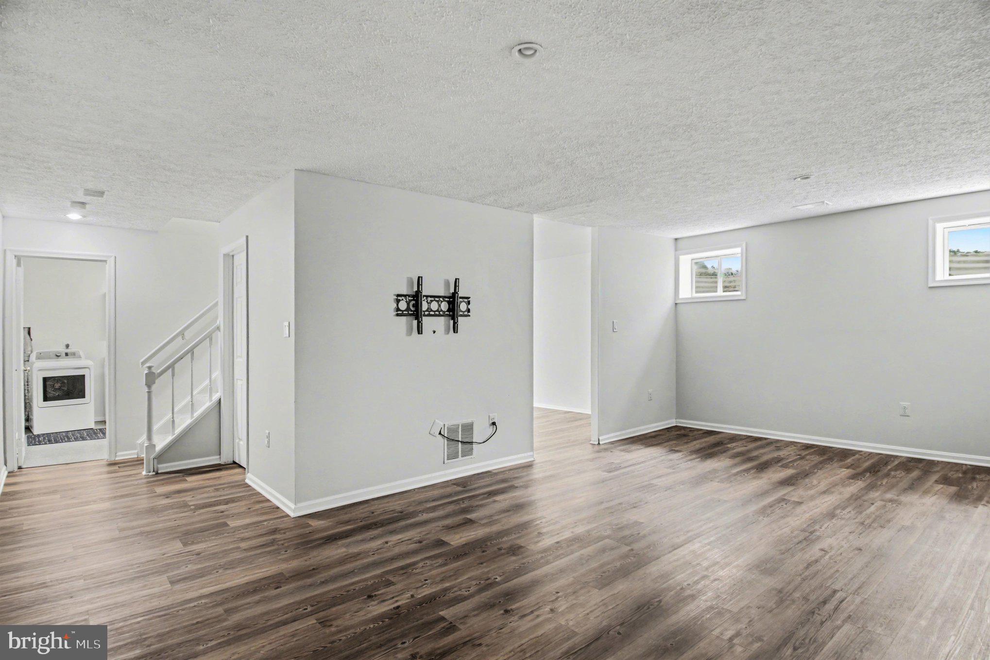 8309 Timber Brook Lane Springfield, VA 22153 - Photo 29 of 39 a view of an empty room with wooden floor