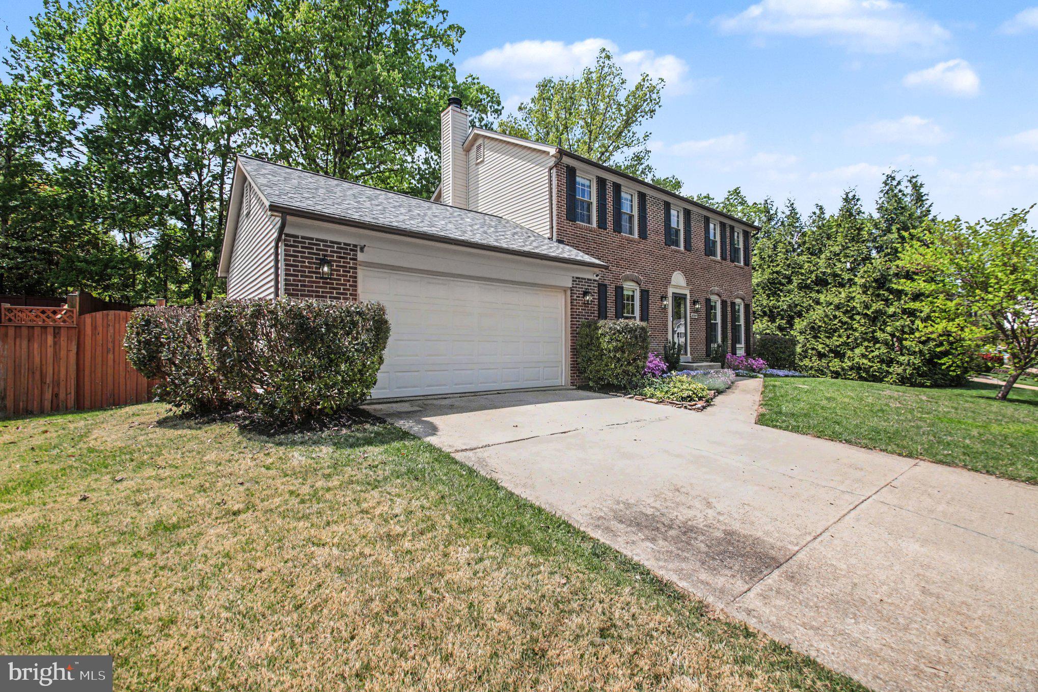 8309 Timber Brook Lane Springfield, VA 22153 - Photo 37 of 39 a front view of a house with a yard