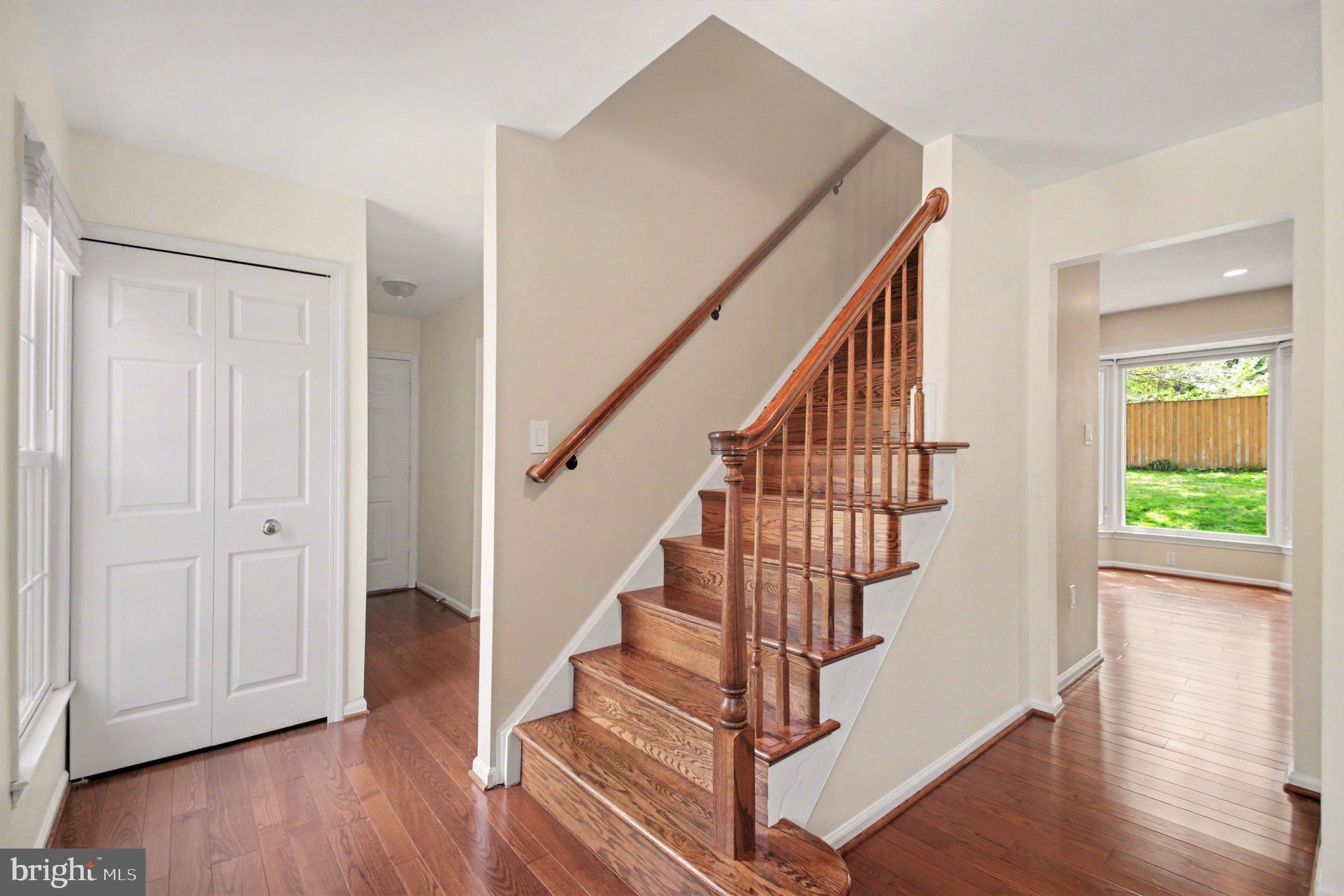 8309 Timber Brook Lane Springfield, VA 22153 - Photo 5 of 39 a view of entryway with wooden floor and stairs