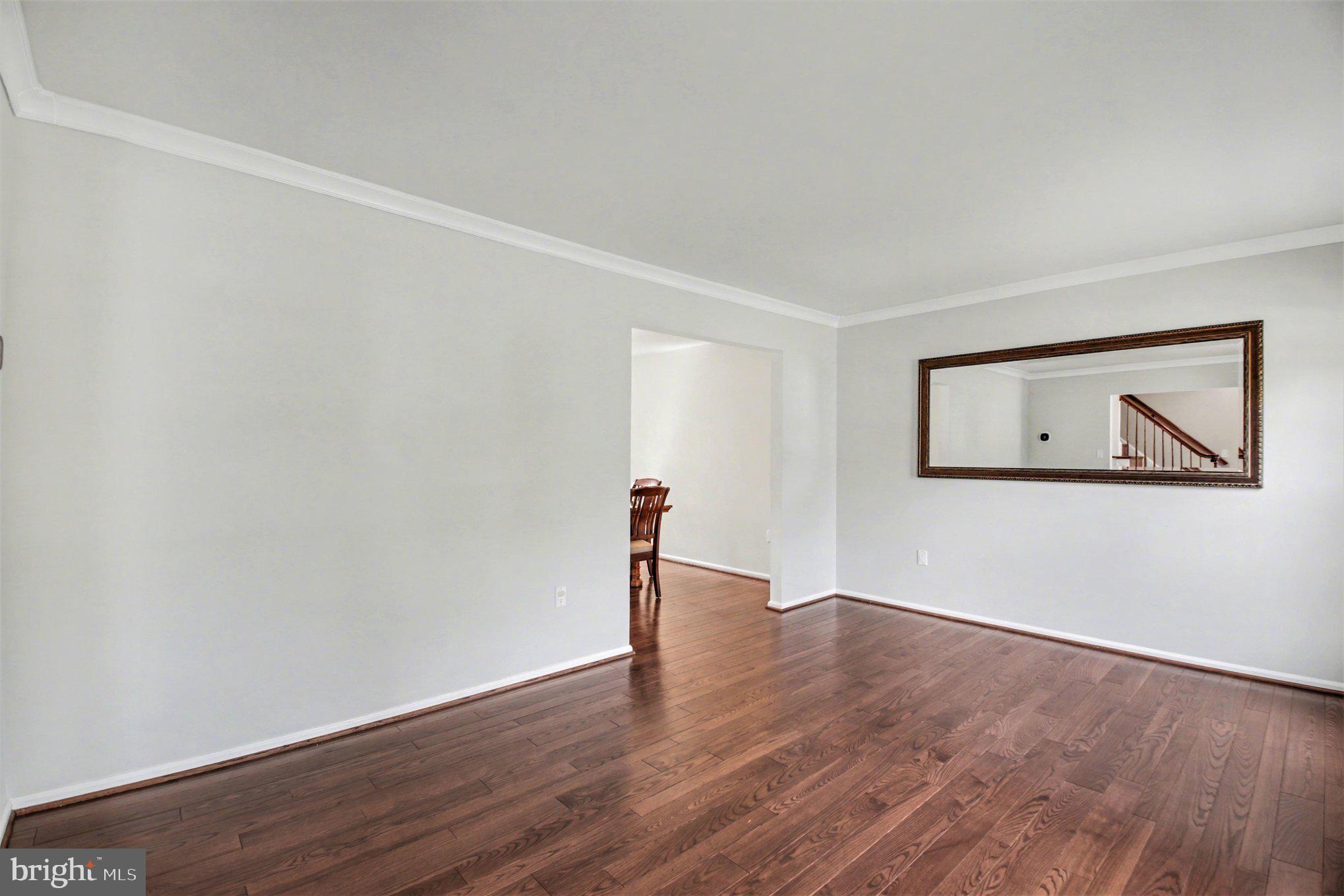 8309 Timber Brook Lane Springfield, VA 22153 - Photo 7 of 39 a view of empty room with wooden floor