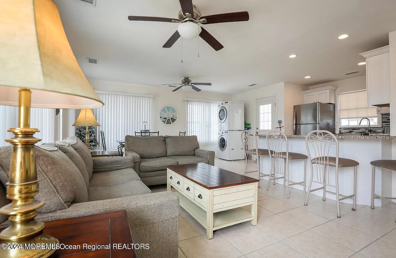 1707 R Baltimore Avenue Lavallette, NJ 08735 - Photo 1 of 11 a living room with furniture and a large window