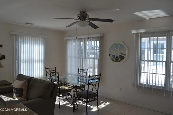a living room with furniture and windows