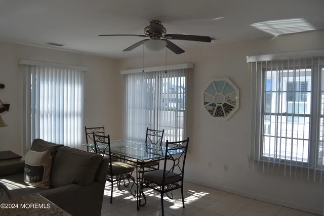 a living room with furniture and windows
