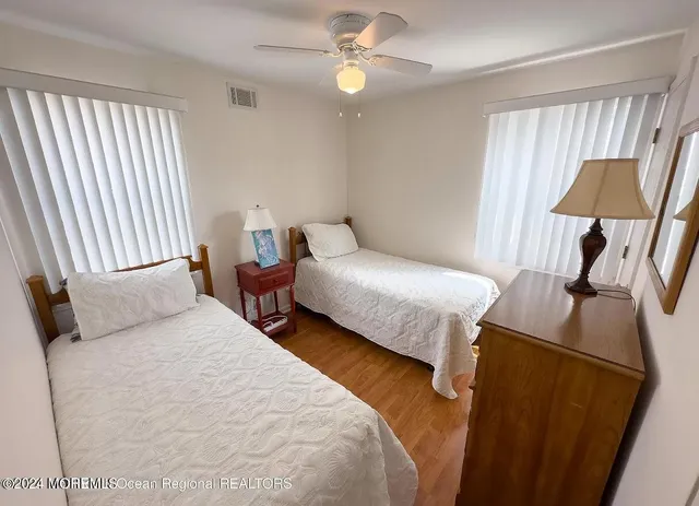 a bedroom with bed and a window