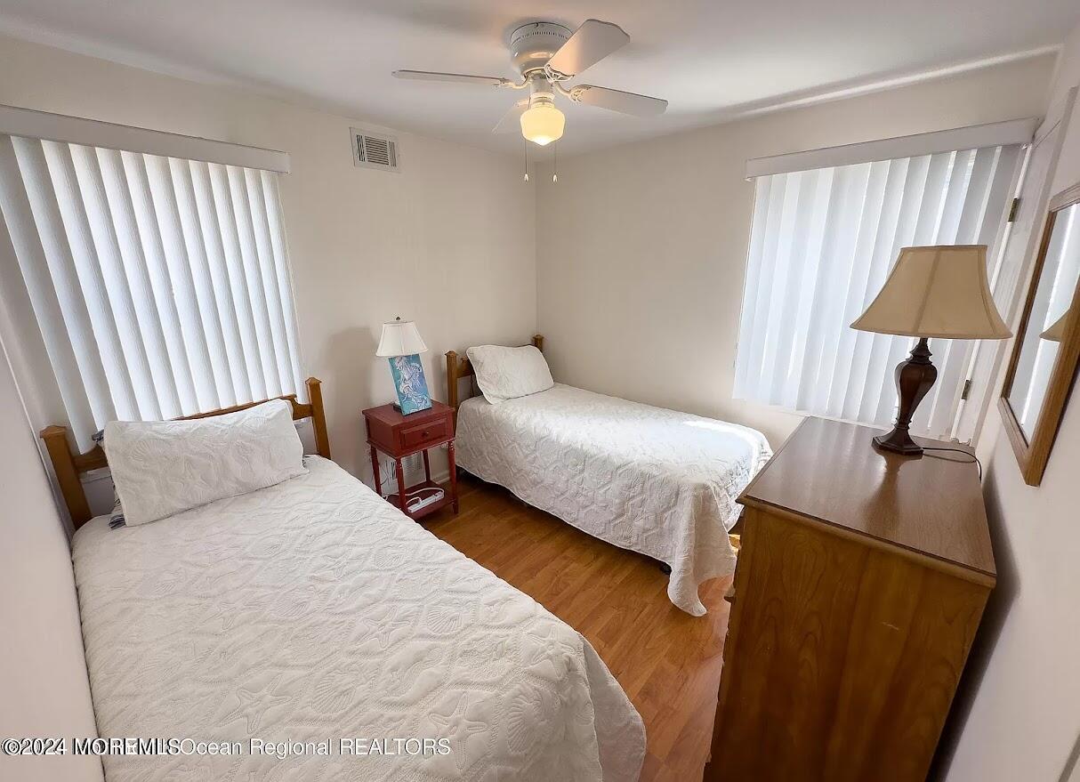 1707 R Baltimore Avenue Lavallette, NJ 08735 - Photo 9 of 11 a bedroom with bed and a window