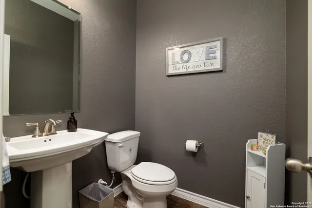 a kitchen with granite countertop cabinets and black appliances
