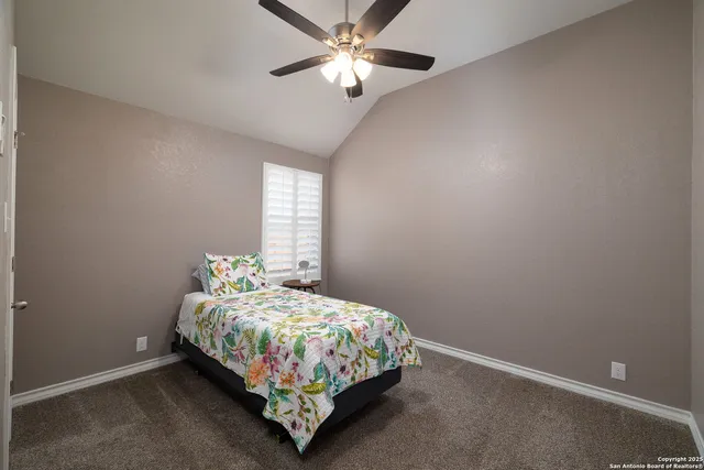 a bathroom with a double vanity sink toilet and a mirror